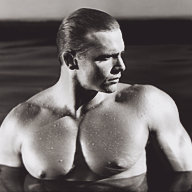 Jim French photograph "John Pruitt, Bel Air" depicting the model John Pruitt, a muscular white male with blonde hair, posing nude in a swimming pool.